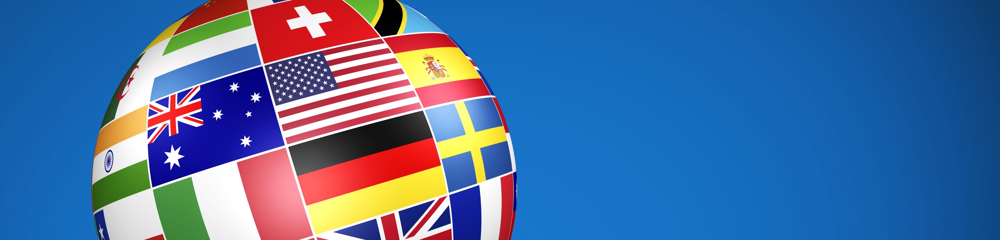 Image with a (deep) blue background. On the left, you can see the upper part of a globe made up of various country flags.
